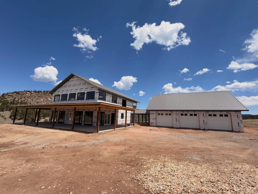 Two-story custom home framing under construction near Westcliffe, Colorado
